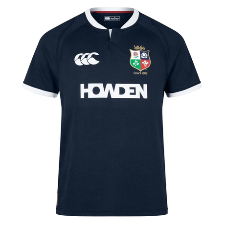 British & Irish Lions 2025 Training Jersey by Canterbury in navy blue, featuring a white collar and trim, the British & Irish Lions logo, anatomically positioned panels, Canterbury branding, and the "HOWDEN" text on the front.