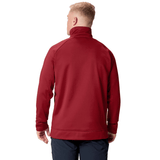 A person with short blond hair is wearing the Canterbury British & Irish Lions 2025 1/4 Zip Fleece in red, paired with dark pants, as they face away from the camera.