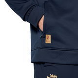 Someone wearing the British & Irish Lions 2025 1/4 Zip Fleece by Canterbury, hands casually tucked in their pockets, could easily be mistaken for a devoted fan of the Canterbury brand.