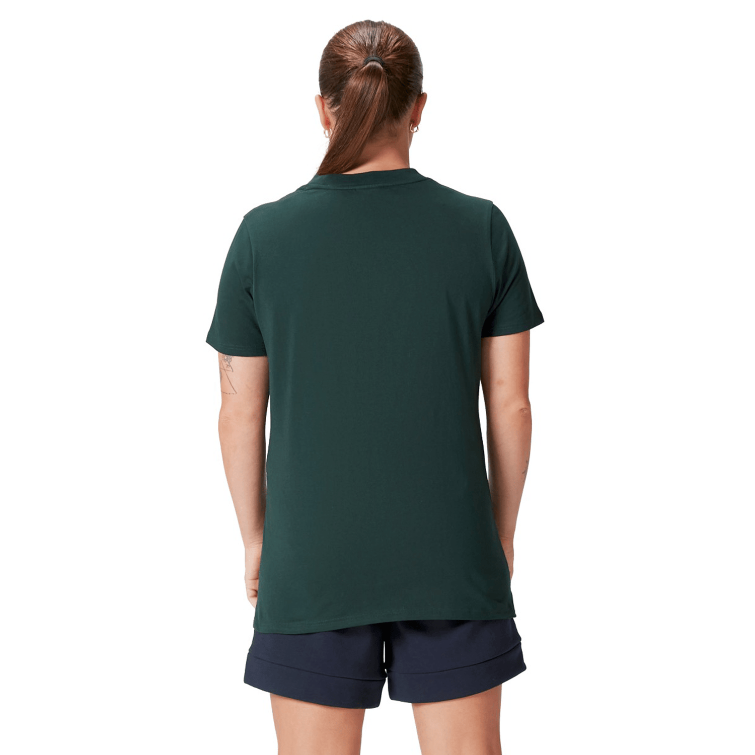 A person with a ponytail wearing a Women's British & Irish Lions 25 Cotton Jersey Tee by Canterbury in dark green and navy shorts, viewed from the back.