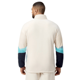 A person wearing the British & Irish Lions 2025 Outback Full-Zip Fleece Jacket by Canterbury is shown from the back, highlighting its dark blue sleeves with light blue accents that embody the adventurous spirit of exploration.