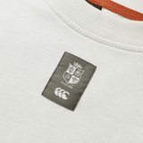 A detailed view of the British & Irish Lions 25 Outback Long Sleeve Tee by Canterbury showcases a logo patch with a shield design, featuring the text "Since 1888" and a stylized emblem below. This white tee embodies the essence of the British & Irish Lions and is crafted to meet Canterbury's high-quality standards.
