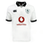 The Ireland 24 Alternate Classic Jersey by Canterbury features a white design with the Ireland Rugby Football Union (IRFU) logo on the left chest, a red Vodafone logo in the center, and a black collar and cuffs. This jersey is crafted using Canterbury's VapoDri technology for optimal performance.