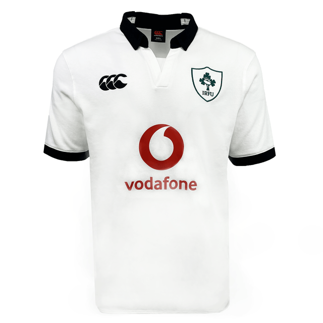 The Ireland 24 Alternate Classic Jersey by Canterbury features a white design with the Ireland Rugby Football Union (IRFU) logo on the left chest, a red Vodafone logo in the center, and a black collar and cuffs. This jersey is crafted using Canterbury's VapoDri technology for optimal performance.