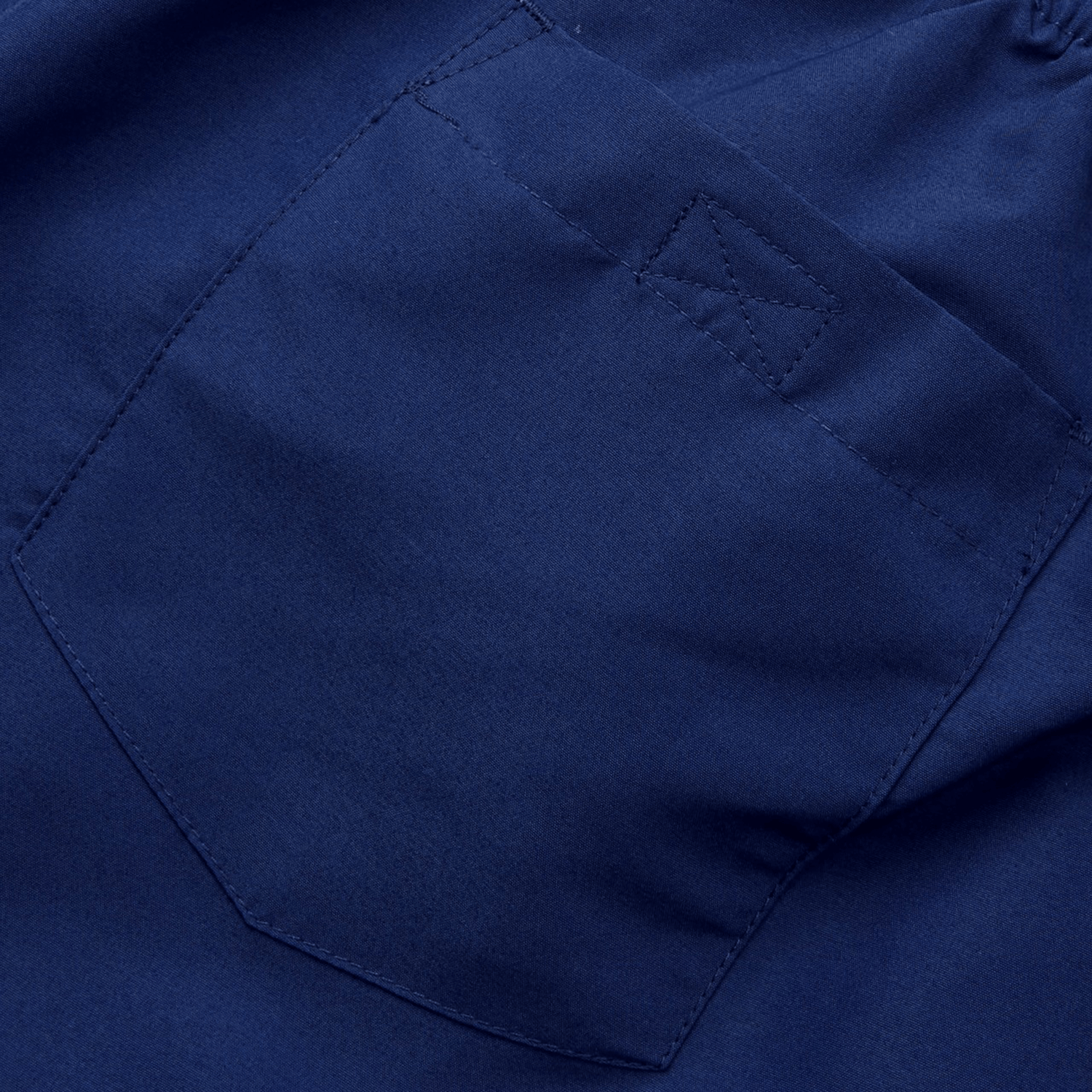 Close-up of the Canterbury Uglies 5" Tactic Short in blue, showcasing a visible pocket with a reinforced stitch at the top corner and characteristic of lightweight shorts with deep pockets.