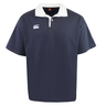 The Canterbury Fundamental Solid Dye Short Sleeve Rugby Jersey by Canterbury is a navy blue polo with a classic collar, white buttons, and a small white logo on the left chest.