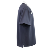 The Canterbury Fundamental Solid Dye Short Sleeve Rugby Jersey by Canterbury features a navy blue design, white polo collar, side hem slits, and a small white chest logo.