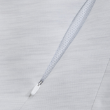 Close-up of the Everest Training Full-Zip Hoodie by Canterbury in light gray, showing the textured inner lining and a diagonal zippered pocket with a white zipper pull.