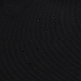 The Everest Training Tee by Canterbury features black textured fabric with six small, evenly spaced holes for breathability—a performance fit designed especially for rugby players.