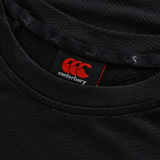Close-up of the black Everest Training Tee by Canterbury, highlighting the red Canterbury logo and inside label—a popular performance fit for rugby players.