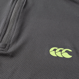 Close-up of the Canterbury Tempo+ 1/4 Zip Training Top, showcasing its textured dark grey fabric, partial zipper, and yellow Canterbury logo.
