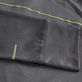 Close-up of the Canterbury Tempo+ 1/4 Zip Training Top in gray, showcasing a textured fabric, pocket detail, and light green stripe accents.