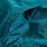 Close-up of Canterbury’s Uglies Logo Tactic Shorts in teal satin, featuring a side pocket and gathered seam detail inspired by classic rugby styles.