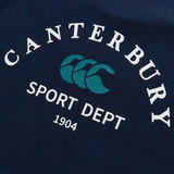 The Sport Dept. Logo T-Shirt by Canterbury is a navy cotton-blend tee with "CANTERBURY SPORT DEPT 1904" in white and a teal triple-C logo—ideal as a classic Canterbury rugby or casual athletic shirt.