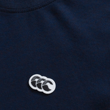 Close-up of the navy Sport Dept. Logo T-Shirt by Canterbury, made from an athletic cotton blend with a small embroidered white and black Canterbury logo featuring three overlapping shapes.