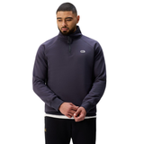 A man in a dark Sport Dept. 1/4 Zip Sweater by Canterbury, featuring a small logo on the chest, stands against a plain white background.