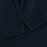 Close-up of the hem and seam of the dark navy Fundamentals CCC Logo Tank by Canterbury, highlighting stitching details and fabric texture inspired by Fundamentals.