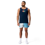 A man wears the Canterbury Fundamentals CCC Logo Tank H225 with a colorful logo, paired with light blue and white athletic shorts and white sneakers, set against a plain white background—a tribute to sporty essentials.