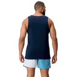 A man faces away from the camera, wearing the Canterbury Fundamentals CCC Logo Tank (H225) and light blue shorts with a dark waistband—ideal for honing training basics.