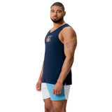 A man stands facing forward against a white background, wearing the Canterbury Fundamentals CCC Logo Tank by Canterbury H225 and light blue shorts, displaying athletic basics with a vibrant logo on his navy tank top.