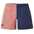 The Women's Fundamentals 3" Harletic Shorts by Canterbury feature a color-block design with a pink left side, navy blue right side, and an elastic waistband.