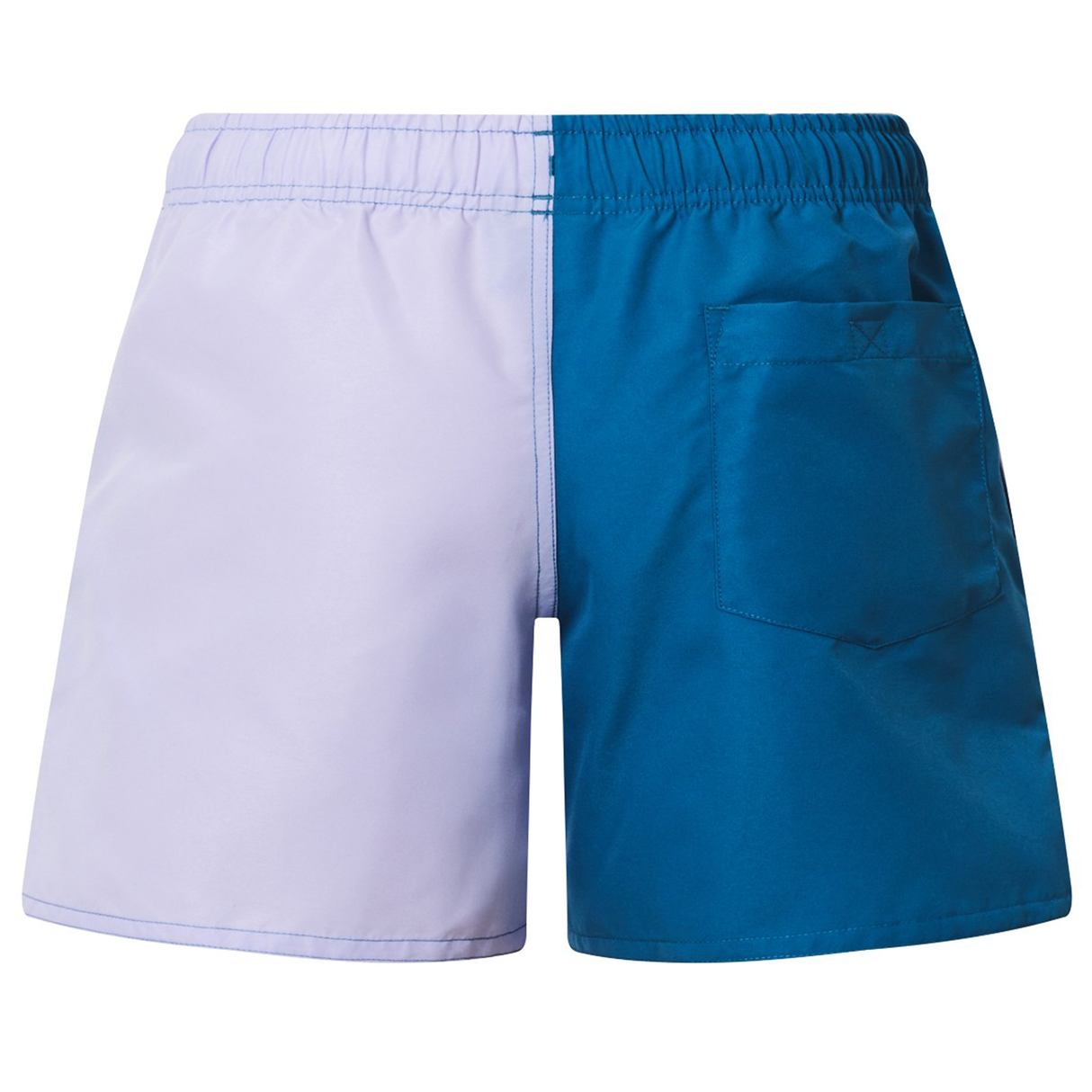 The Canterbury Women's Fundamentals 3" Harletic Shorts feature a two-tone design with a light purple left side, blue right side, elastic waistband, and a single back pocket, inspired by athletic training wear.