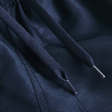 Close-up of navy blue drawstrings with metal tips on Canterbury Women’s Fundamentals 5" Panel Tactic Shorts, highlighting the premium details of these athletic shorts.