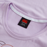 Close-up of the Women's Fundamentals CCC Logo T-Shirt by Canterbury, a light purple rugby tee for women, showing the collar, inner neck tape, and black size label with red logo and text indicating size 10 and made in China.