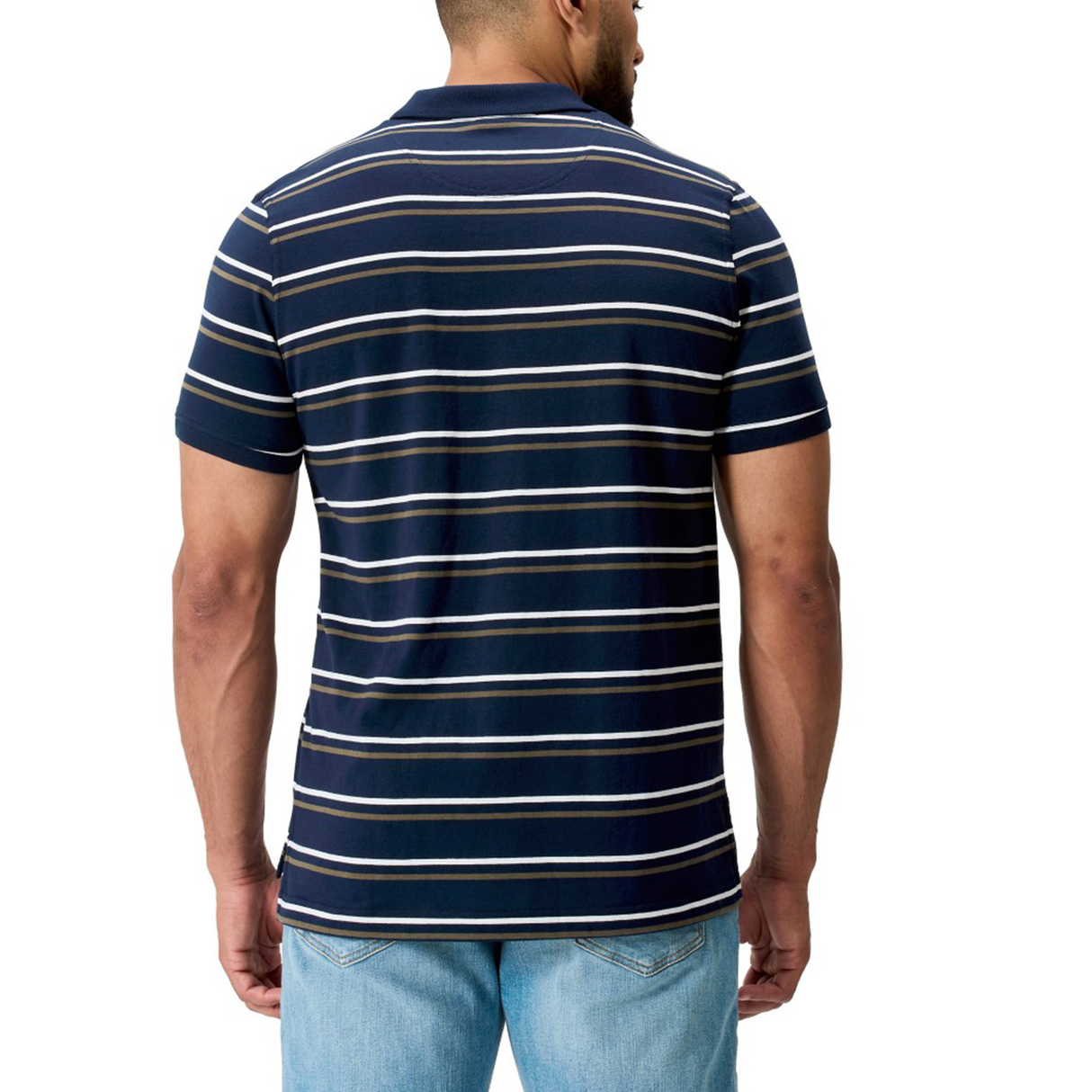 A man is shown from the back wearing the Canterbury Fundamental Yarn Dye Stripe Polo in navy with white and light gray stripes, paired with light blue jeans.