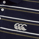 Close-up of the Canterbury Yarn Dye Stripe Polo by Canterbury in navy blue, showcasing white and olive green stripes, classic white buttons, and an embroidered white logo with three overlapping shapes—a perfect choice for fans of timeless rugby polo style.