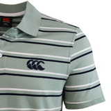 The Fundamental Yarn Dye Stripe Polo by Canterbury features green fabric, short sleeves, horizontal black and white stripes, and a chest logo.