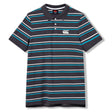 Introducing the Canterbury Yarn Dye Stripe Polo by Canterbury. This short-sleeve polo showcases a timeless black base, accented with blue, white, and teal horizontal stripes. The design features a three-button placket and a crisp white Canterbury logo on the left chest, merging sporty flair with everyday comfort.