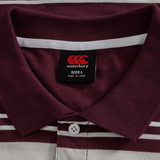 Close-up of the Fundamental Engineered Stripe Polo by Canterbury in maroon and white, size L, featuring a visible Canterbury brand label and white button below the collar—perfect for rugby polo fans.