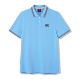 Canterbury Solid Dye Polo by Canterbury: This light blue short-sleeve athletic polo shirt features a collared neckline with two buttons, a black Canterbury logo on the left chest, and striped edging on the collar and sleeves.