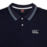 Canterbury Solid Dye Polo in navy blue featuring a white-striped collar, two-button placket, and Canterbury logo on the left chest for an athletic look.