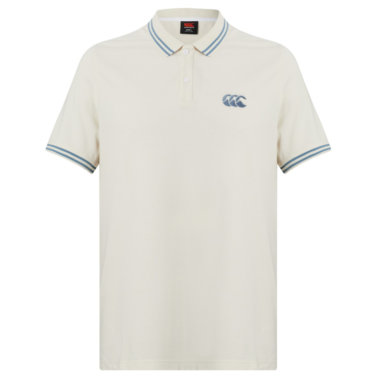 The Canterbury Fundamental Solid Dye Polo is cream-colored with a rugby-inspired look, featuring blue and white striped collar and cuffs, plus a blue logo on the left chest.