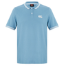 The Fundamental Solid Dye Polo by Canterbury features a light blue solid dye, white collar and sleeve stripes, three-button placket, and a white logo on the left chest for a classic rugby-inspired style.