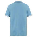 The Fundamental Solid Dye Polo by Canterbury is shown from the back in light blue, featuring short sleeves and white-striped edges on the collar and cuffs.