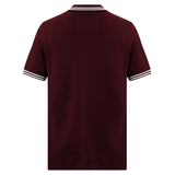 The Fundamental Solid Dye Polo by Canterbury, in burgundy, features white and black stripes on the collar and sleeve cuffs with a rugby-inspired back design.