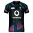 Front view of the Ireland 25/26 Pre Game Pro Jersey by Canterbury, featuring IRFU and Vodafone logos, a black collar and cuffs, and a colorful abstract pattern on dark fabric. Made with Canterbury Vapodri for comfort and performance.