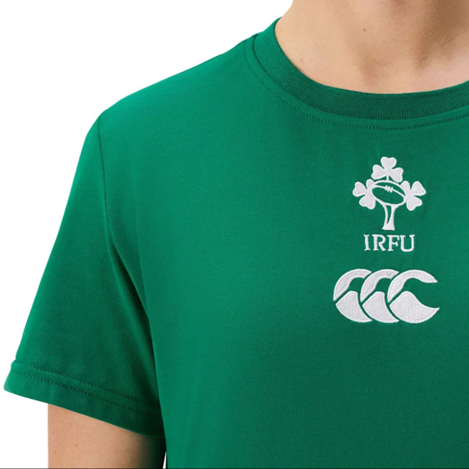 A person wearing the Women's Ireland 25/26 Cotton Team T-Shirt by Canterbury, featuring the IRFU shamrock and Canterbury logos on the chest.