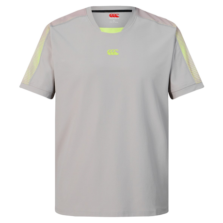 The Canterbury Tempo+ Drill Top is a light grey short-sleeve training top featuring yellow shoulder accents and a small chest logo, made from moisture-wicking fabric to keep you cool and comfortable during workouts.