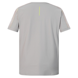Back view of the Canterbury Tempo+ Drill Top in light gray, featuring short sleeves, mesh shoulder panels, moisture-wicking fabric, and a thin vertical yellow stripe near the collar.