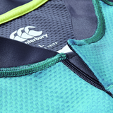 Close-up of the Ireland 26/27 Summer Tour "Baltic" Training Test Jersey by Canterbury, highlighting stitching, textured fabric, brand logo, and label—perfect for fans after an authentic Canterbury IRFU training jersey.