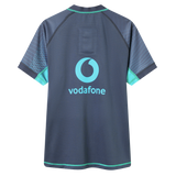 The Ireland 26/27 Summer Tour "Baltic" Training Test Jersey by Canterbury is a short-sleeved dark blue IRFU rugby jersey with light blue and teal accents and the Vodafone logo on the back, crafted in Canterbury’s Test Fit.