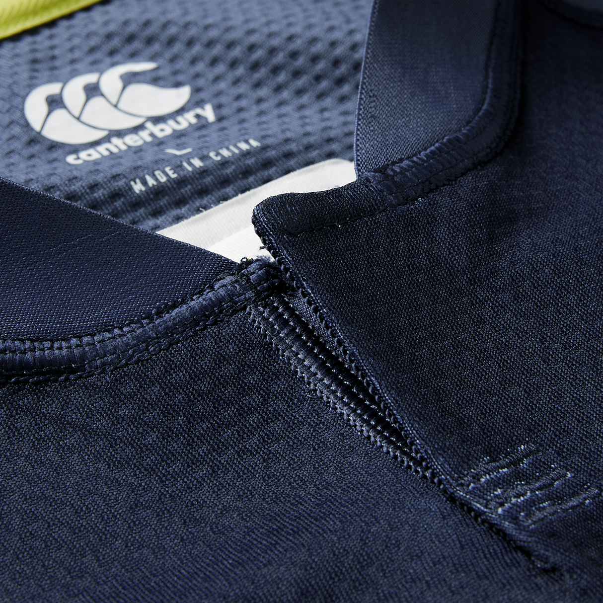 Close-up of the Ireland 26/27 Summer Tour "Indigo" Training Test Jersey by Canterbury, highlighting the collar, neckline stitching, and inner logo label—perfect for fans wanting that authentic Summer Tour style.