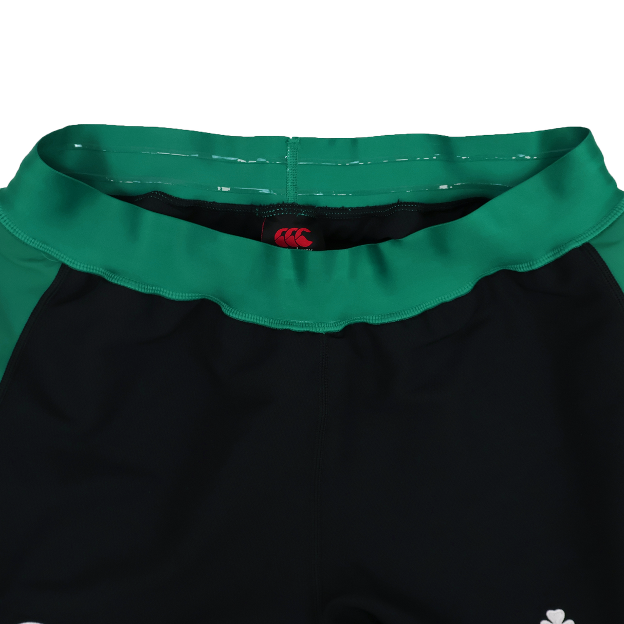 Close-up of the waistband on the Ireland 25/26 Alternate Match Short by Canterbury, black and green with a red Canterbury logo on the inner waistband.