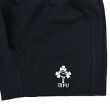 Close-up of the Ireland 25/26 Training Short by Canterbury, featuring the white IRFU logo with a rugby ball and shamrock embroidered on the lower hem.