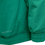 Close-up of the Ireland 25/26 Anthem Jacket by Canterbury, showing a visible pocket zipper, ribbed hem and cuffs, and "VapoShield" printed near the bottom.