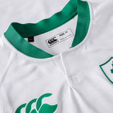 Close-up of the Women's Ireland 25/26 Alternate Pro Jersey by Canterbury, size 10, in white with green collar and trim, brand label visible, and a partial green chest logo.